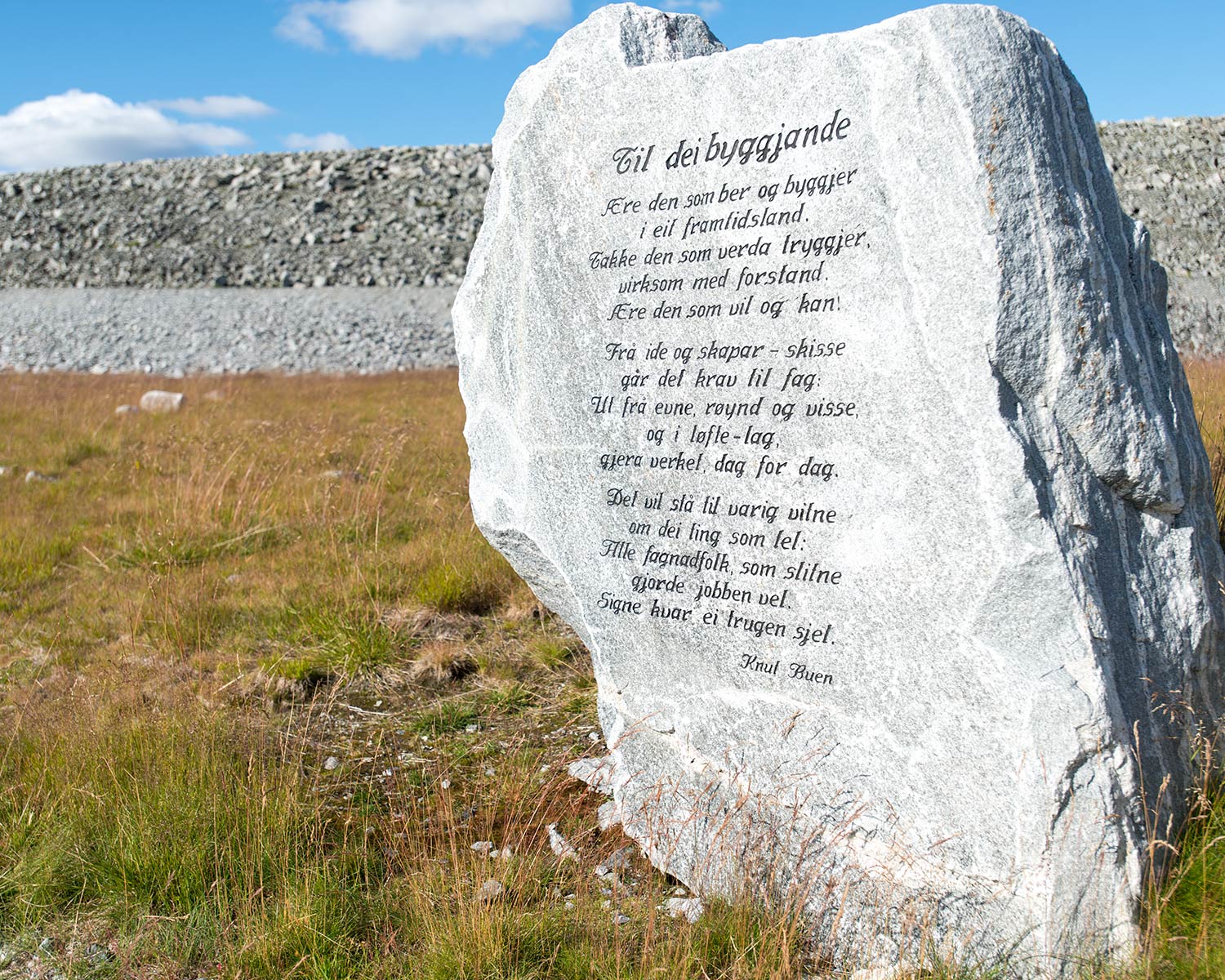Stone block at Songa dam engraved with a poem by artist and musician Knut Buen.